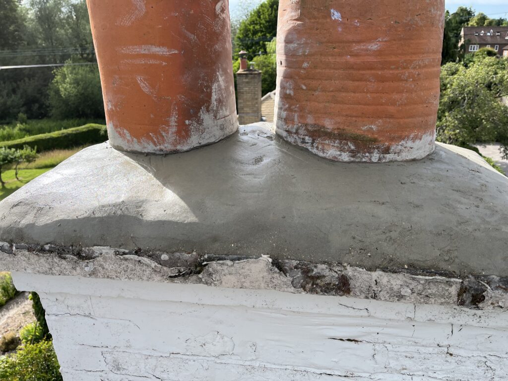 Newly re-bedded pots and rebuilt flaunching shedding water correctly